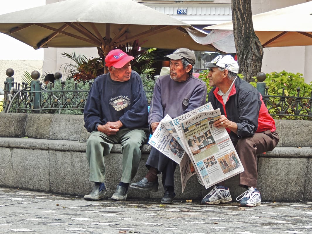 Men Discussing the News